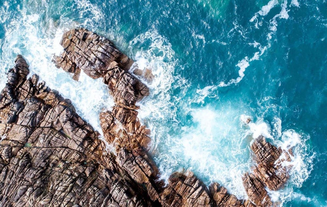a group of blue docked in a harbor